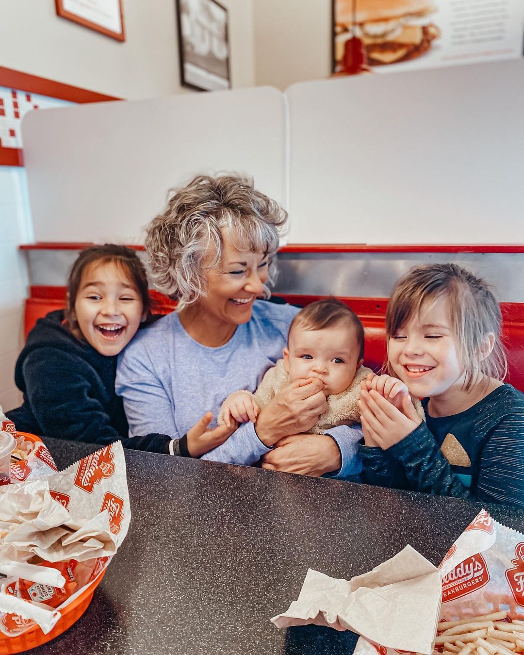 Family enjoying freddy's frozen custard & steakburgers