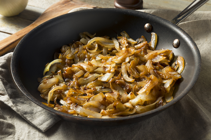 Caramelized onions cooking in a skillet