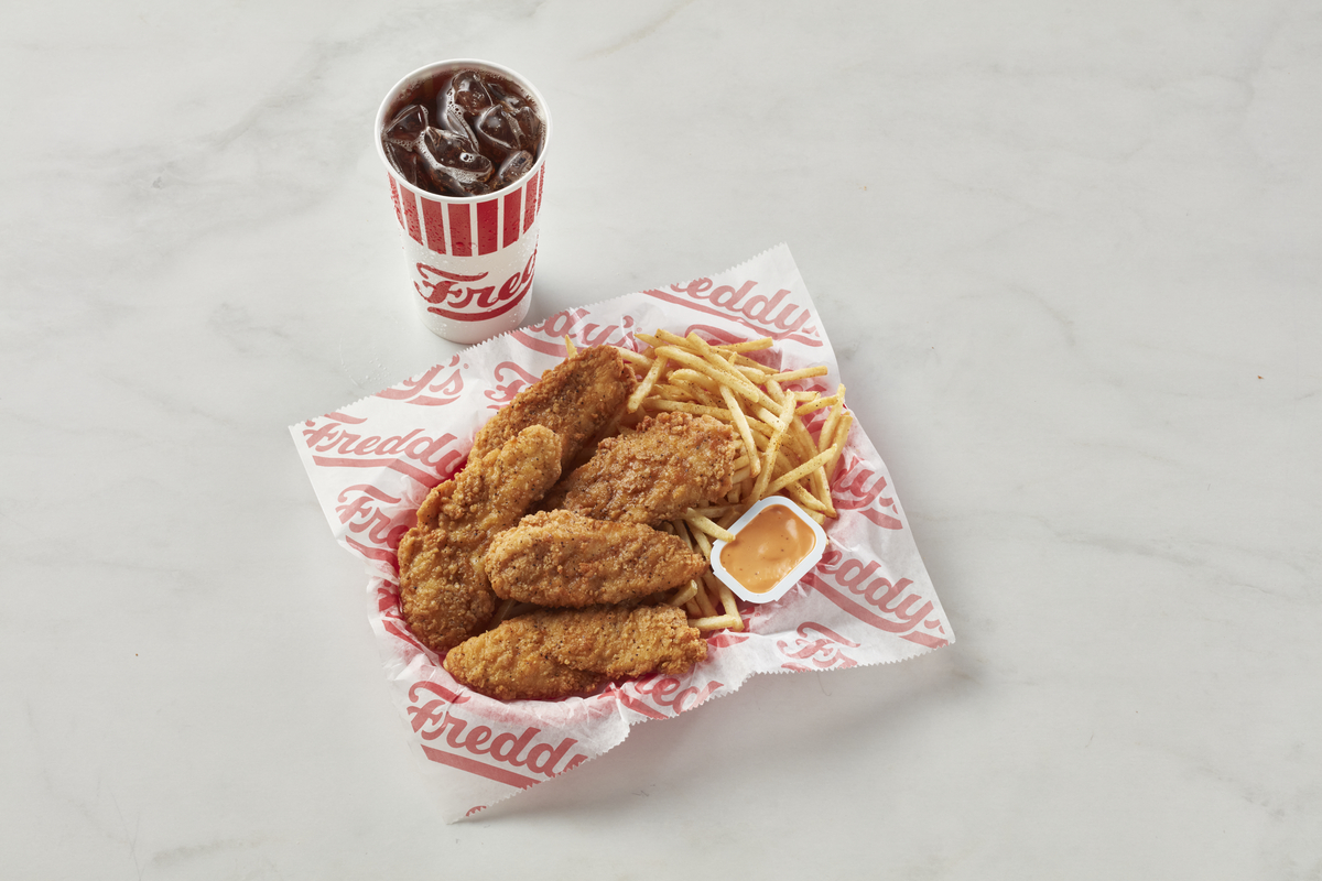 Freddy’s 5 piece Chicken Tender Combo meal with fries, dipping sauce, and a soft drink