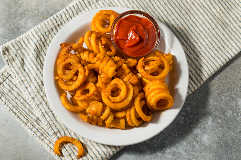 Crispy curly fries with ketchup