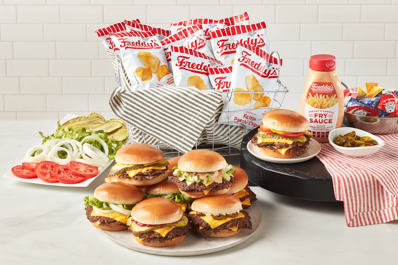 Freddy’s Burger Bar Catering with steakburgers, chips, toppings, and fry sauce