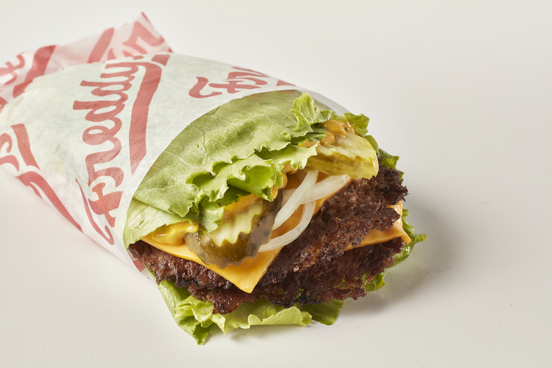 Freddy’s lettuce wrap burger with cheese, pickles and onion