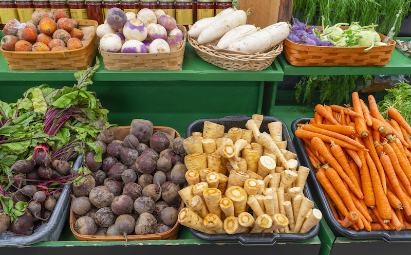 Fresh root vegetables at market stand