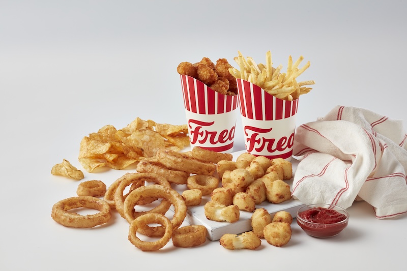 Freddy's sides including cheese curds, onion rings, fries, tots and chips