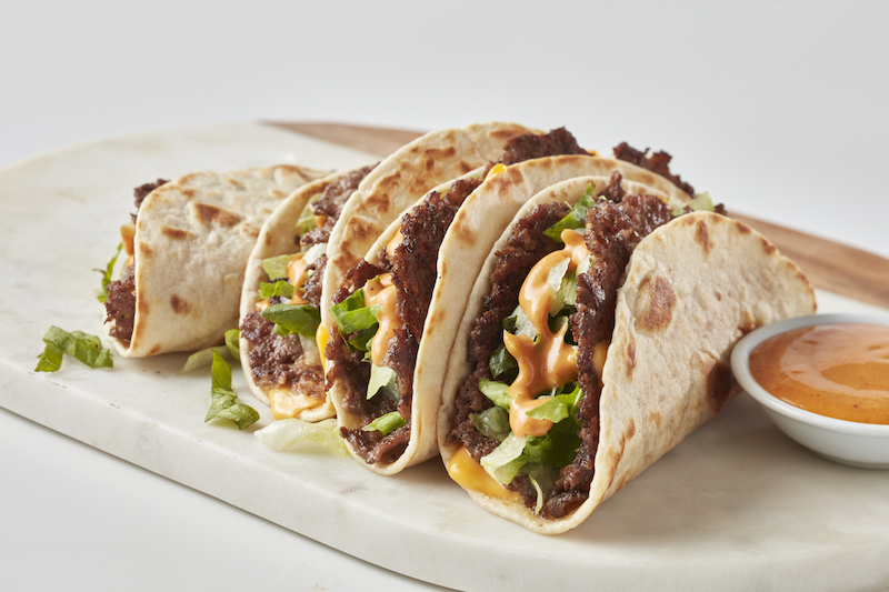 Freddy’s steakburger tacos with cheese, lettuce, and sauce