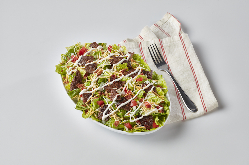 Freddy's Steakburger Bowl with lettuce, cheese, bacon, tomatoes, and dressing