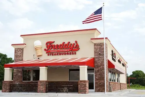 Freddys building exterior with flag
