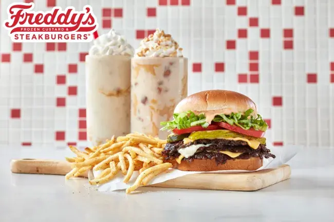 Freddy's Steakburger Stacker with fries, Reese's Peanut Butter Creamy Shake and Reese's Crunchy Peanut Butter Concrete