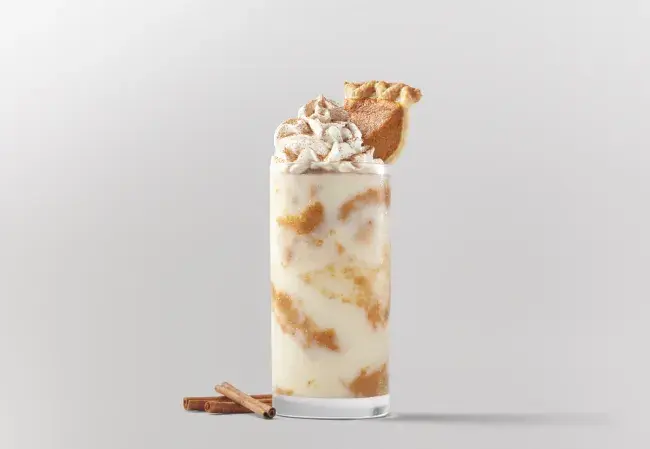 Freddy’s pumpkin pie concrete topped with whipped cream and a slice of pumpkin pie