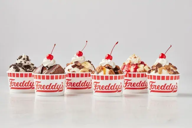 Assorted Freddy’s frozen custard sundaes with different toppings