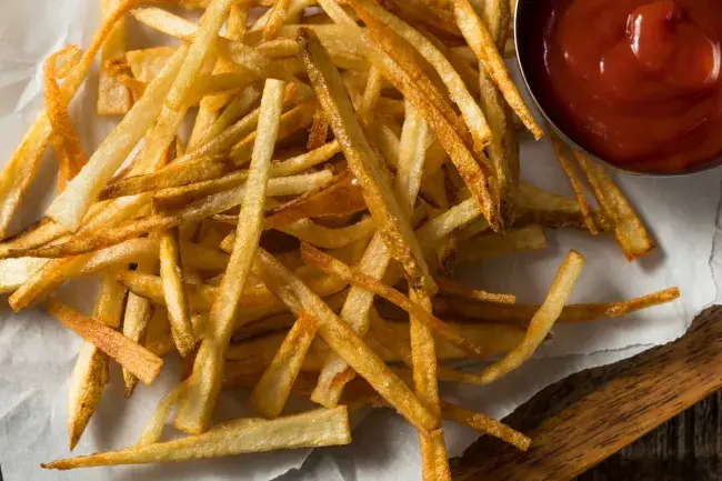 Crispy thin cut fries with ketchup