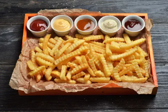 Crinkle-cut fries served with assorted dipping sauces