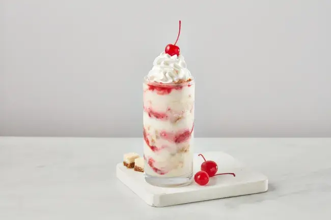 Freddy’s Cherry Cheesecake concrete topped with whipped cream and a cherry