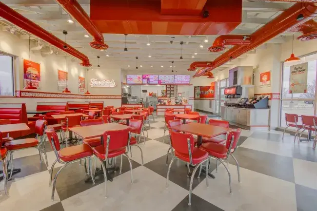 Interior dining area of a Freddy's Frozen Custard &amp; Steakburgers restaurant