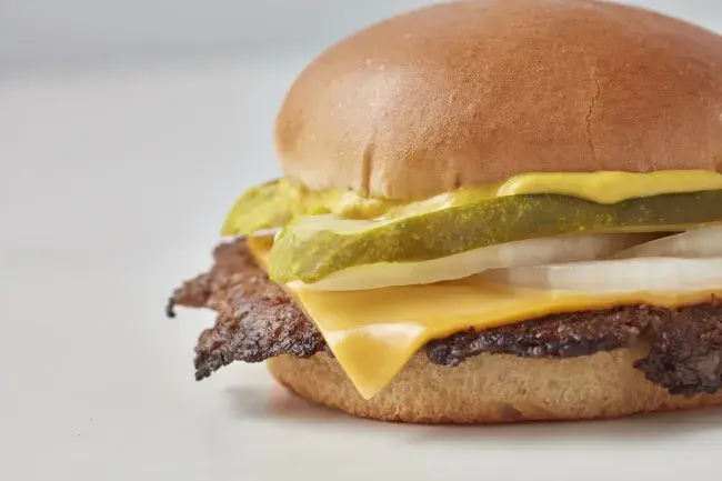 Freddy's Original Single Steakburger with cheese, pickles, onions, and mustard