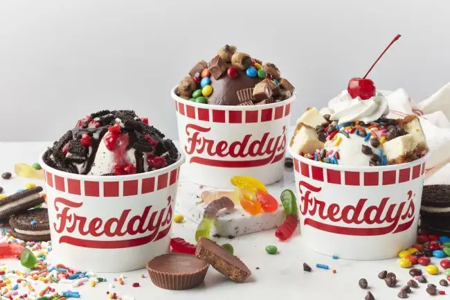 Freddy’s frozen custard sundaes with assorted candy and cookie toppings