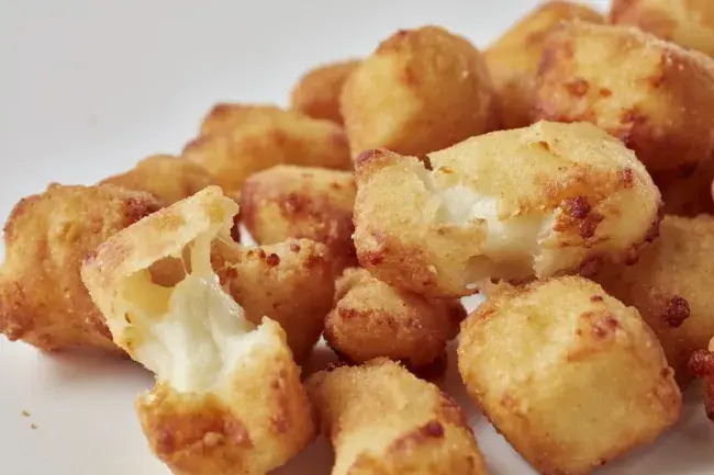 Freddy's Cheese Curds with crispy golden breading and melted cheese inside