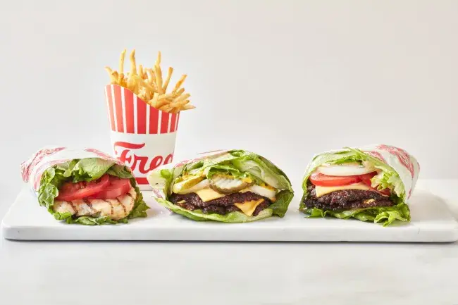 Three Freddy’s lettuce wraps with a side of fries