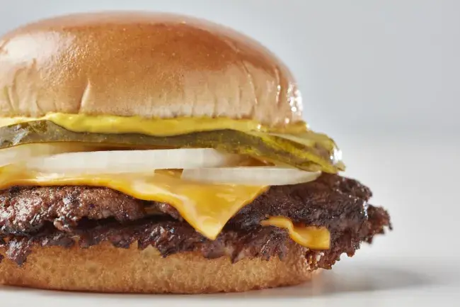 Freddy’s Original Double steakburger with melted cheese, pickles, onions and mustard