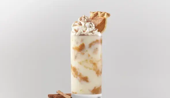 Freddy’s pumpkin pie concrete topped with whipped cream and a slice of pumpkin pie