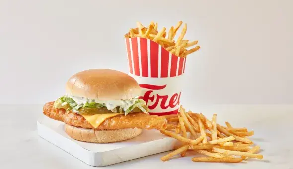 Freddy's Deluxe Crispy Fish Sandwich with fries