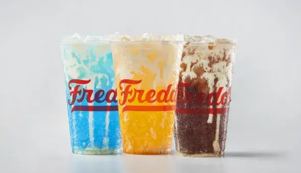 Trio of Freddy's Bevies. From left to right: Blue Rizzberry Custard Cream Soda, Golden Hour Orange Custard Cream Soda, and Coco Loco Custard Cream Soda.