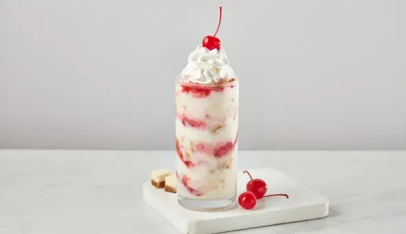 Freddy’s Cherry Cheesecake concrete topped with whipped cream and a cherry