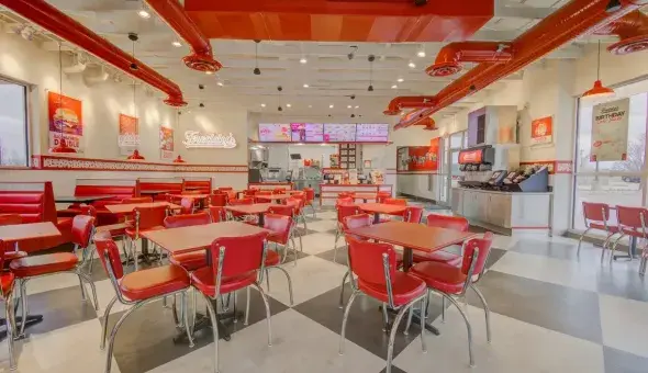 Interior dining area of a Freddy's Frozen Custard &amp; Steakburgers restaurant