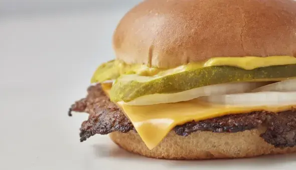 Freddy's Original Single Steakburger with cheese, pickles, onions, and mustard