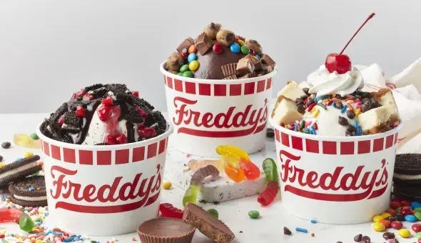 Freddy’s frozen custard sundaes with assorted candy and cookie toppings