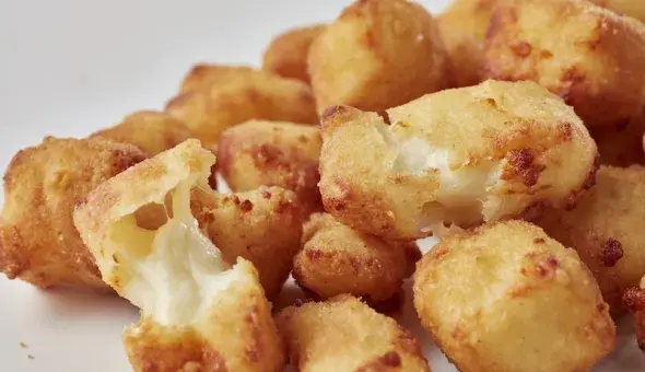 Freddy's Cheese Curds with crispy golden breading and melted cheese inside